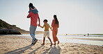 Family, parents and children walking on beach sand for summer holiday, vacation and outdoor wellness. Back of mother, father and kids holding hands for support, love and care by the ocean or sea