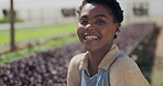 Woman, face and greenhouse gardening for agriculture production or supply chain, quality assurance or inspection. Black person, smile and countryside for eco friendly vegetable, plants or environment