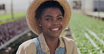 Woman, face and greenhouse gardening for agriculture supply chain for small business, vegetables or environment. Black person, hat and smile on plant field for quality assurance, produce or nutrition