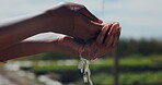 Hand, water and washing on outdoor farm for hygiene at agriculture job for quality assurance, health or nutrition. Person, cleaning and eco environment at greenhouse for bacteria, plants or wellness
