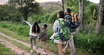 Holding hands, walking or family trekking in forest to relax on holiday vacation together in nature. Children siblings, mother or back of father in woods hiking on outdoor adventure for love or care