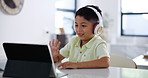 Boy, video call and headphones and tablet for education online, wave hello and school at home. Distance learning, technology and audio with test or exam, kid student studying and elearning forr 