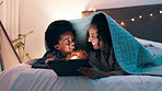 Tablet, search and mother and son on a bed with cartoon, movie or streaming funny video in their home. Digital, app and mom with kid in a bedroom for online comic, love and bonding with blanket fort