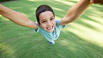 Face, smile and boy spinning in garden with parent for love, fun or bonding together as family. Portrait, energy or happy and excited young child swinging with hands on grass in backyard for trust