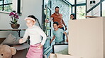 Family, moving into new house and children running with parents excited for mortgage, real estate or home. Mexican father, mother and kids in front door with boxes for dream property and investment