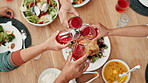 Hands, food and toast for thanksgiving with family together in home for celebration event of tradition. Cheers, party or gathering with group of people in an apartment, bonding over meal from above