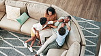 Happy, tickling and parents with children on sofa having fun, bonding and relaxing together at home. Laughing, love and top view of boy kids playing with mother and father in living room at house.