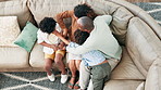 Happy, tickling and parents with children on sofa having fun, bonding and relaxing together at home. Laughing, love and top view of boy kids playing with mother and father in living room at house.