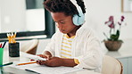 Black child, calculator and writing in book with headphones for mathematics, learning or education at home. Young African kid or little boy taking notes for calculation, counting numbers or homework