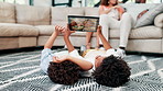 Kids, carpet and tablet with fun, relax and happiness with weekend break and peaceful in a lounge. Playing, family home and brothers with technology and social media with digital app and connection