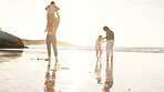 Happy family, feet and wet sand on beach for playing, love and bonding together on summer vacation. Father, mother and children in sunlight in care, travel adventure or holding hands or game by ocean