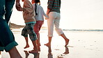 Happy family, feet or beach sand by holding hands in bonding, running or love to play on summer vacation. Parents, children or care on walk together on travel adventure, fun or sunset view by ocean