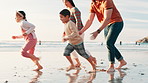 Holiday, game and family running on beach at sunset playing with freedom, happiness and energy. Summer, vacation and parents with children on sand and bonding together in adventure or journey