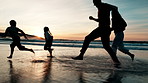 Splash, water and family running on beach at sunset playing with freedom, energy and silhouette. Summer, vacation and parents bonding with children in game with sea or ocean together on adventure