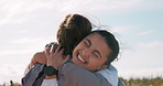 Happy, nature and girl friends hugging for good news, celebration or achievement together. Smile, excited and young women embracing with love, care and friendship in outdoor field at countryside.