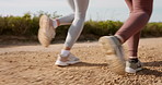 Closeup, dirt road and women with fitness, running and exercise with a challenge and countryside. Sneakers, girls and runners with shoes and workout with training, cardio and healthy with energy