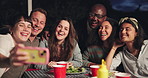 Happy people, friends and selfie at night for dining, event or outdoor get together on bench. Group smile in diversity for photography, picture or memory by dinner table in the late evening outside