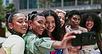 Friends, women and pose in selfie outdoor, influencer group and memory in city for social media post. Young, happy in picture for content creation and peace sign with gen z, photography and diversity