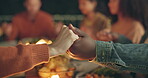 Closeup, holding hands and praying, food and friends worship together, gratitude and thanks to God at dinner party. Men, women with nutrition and religion, celebration and social event at night