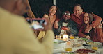Friends, photography and outdoor dinner with phone, patio or happy for new years eve celebration on blog. Women, men and group with sign, icon and hug with smartphone screen for post on social media