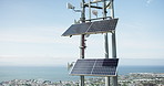 Solar panel, energy and roof with skyline, city and ocean with sustainability, power or off grid development. Photovoltaic tech, electricity and outdoor with blue sky background with buildings by sea