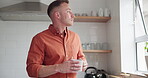 Man, drinking coffee and daydreaming or thinking at home, peace and relaxing or calm in kitchen. Male person, beverage and hot tea for comfort, window and reflection or inspiration and mug for future