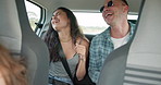 Happy people, dancing and singing in car for road trip, travel or adventure in transportation. Excited man and woman or friends enjoying bonding, holiday or weekend vacation in vehicle together