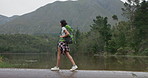 Nature, backpack and young woman hiking in forest on vacation, adventure or weekend trip. Travel, walking and female person trekking for fun in outdoor woods with bag for exploring on holiday.