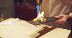 Hands, sushi and fire at restaurant for cooking, meal prep or food on table at diner, cuisine in night. Person, kitchen and blue flame with blowtorch, ready and service for nutrition, diet or snack