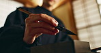 Hand, brush in ink for writing and Asian calligraphy or ancient script for art and inkstone. Japanese creativity, black paint and vintage tools, paintbrush and person with traditional stationery