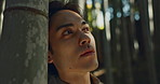 Face, thinking or Asian man in forest for journey on holiday, vacation for freedom or wellness. Nature, travel and Japanese male person with ideas for calm, peace and inspiration to relax in park