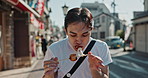 Man, street food and eating kebab on walk on travel, city and hungry for goheimochi with nutrition, diet or lunch. Person, rice snack and skewer on metro sidewalk, vacation and urban road in Japan