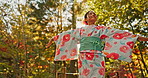 Gratitude, happy or calm Asian woman in park for journey on holiday vacation for freedom or wellness. Nature, travel or Japanese person with smile for health, peace and inspiration to relax in forest