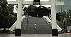 Shinto woman, stairs and torii gate at temple on walk at temple for faith, spiritual journey or zen reflection. Japanese person, steps and traditional culture with indigenous clothes, back and Tokyo