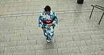 Japanese woman, culture and walk in kimono on stairs, city and wellness for heritage celebration. Young person, relax and traditional clothes in tokyo with beauty, steps and pride in japan fashion