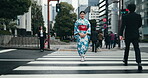 Japan, woman and walk by pedestrian crossing in kimono, city and travel for heritage celebration in streets. Person, happy and traditional clothes in tokyo culture and wellness in fashion in pride