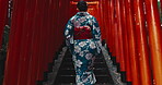 Japan, woman and walking on stairs in kimono, buddhism ceremony and religion in city for heritage. Person, spiritual journey or traditional clothes in tokyo culture or style dress as fashion in town