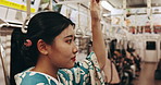 Train, travel and Japanese woman on commute in traditional clothes, culture and kimono in city subway. Fashion, indigenous style and person in fast vehicle, metro transport and trip in urban town