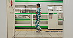 Subway, walking and japanese woman with train, platform and public transportation of a geisha. Metro, urban and Japan travel with transport, journey and commute in the city with trip and railway