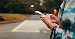 Hands, phone and closeup of woman in city networking on social media, mobile app or the internet. Travel, street and female person researching on cellphone in an outdoor road in urban Tokyo town.