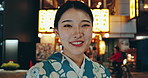 Japan, woman and face in town in kimono, urban outdoor and happiness in street for heritage pride. Person, smile portrait or traditional clothes in tokyo culture or positive in style dress as fashion