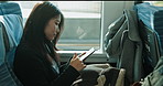 Train, Japanese woman and cellphone with a smile, typing or connection with adventure, journey and travel. Person, commute or girl with a smartphone, internet or mobile user with break or digital app