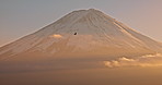 Drone, landscape and mountain with clouds at sunset with sky, nature and bird in flight. Fujiyoshida, Japan and skyline of environment in summer with aerial view of hill with freedom and peace