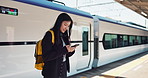 Asian woman, phone and train for travel, communication or social media at railway station. Female person smile with backpack or bag on mobile smartphone waiting for transportation, trip or traveling