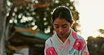 Bow, tradition and Asian woman greeting in the city with calm, zen and peaceful attitude. Culture, garden and young female person with kowtow in Japanese kimono at outdoor park in urban town.