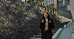 Japanese woman, student and walking with backpack, smile and commute at campus for education in Tokyo. Girl, person and outdoor at college for learning, development and happy on stairs with thinking