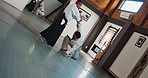 Aikido, sensei and Japanese students with fighting, fitness and action in class for defence or technique. Martial arts, people or training with discipline, uniform or confidence for culture and skill