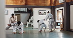 Students, karate or people learning in dojo for fitness, martial arts discipline or self defense combat. Demonstration, workout or kung fu master training athletes for fighting, education or class