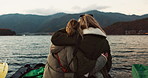 Women friends, hug and back at beach with care, love and outdoor with high five, support or celebration on travel. Girl, cheers and achievement with boat, water or lake with bonding by river in Japan