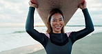 Woman, face and surfboard on head at beach, smile and ready for workout, training and wellness in morning. Person, surfer and board by sea, waves or ocean in portrait with water sports in Japan